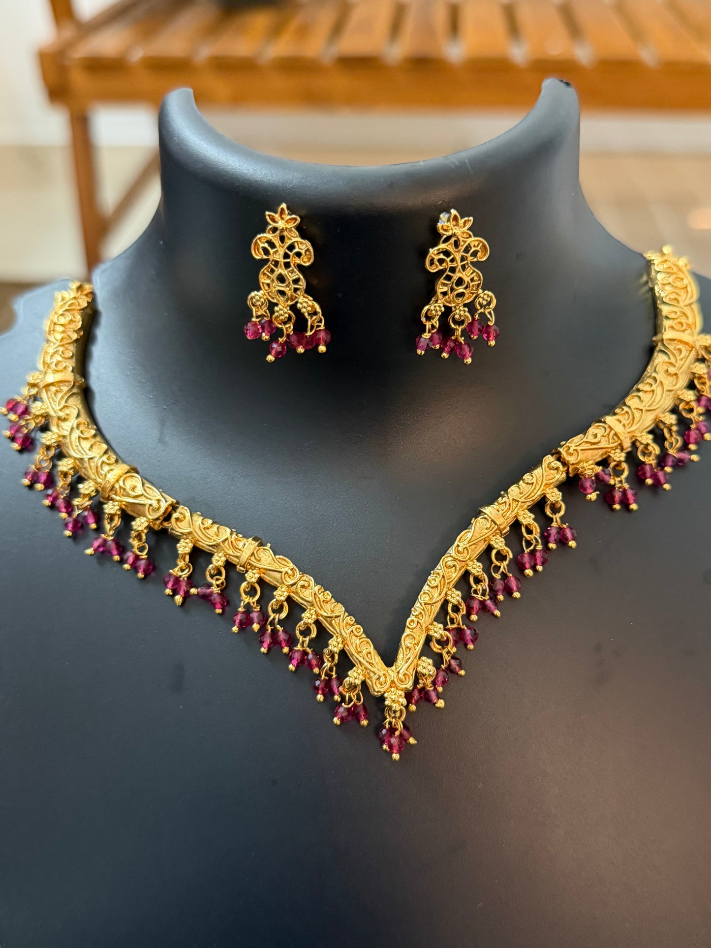 V shaped necklace with ruby color pearl hanging : Code RJ1250