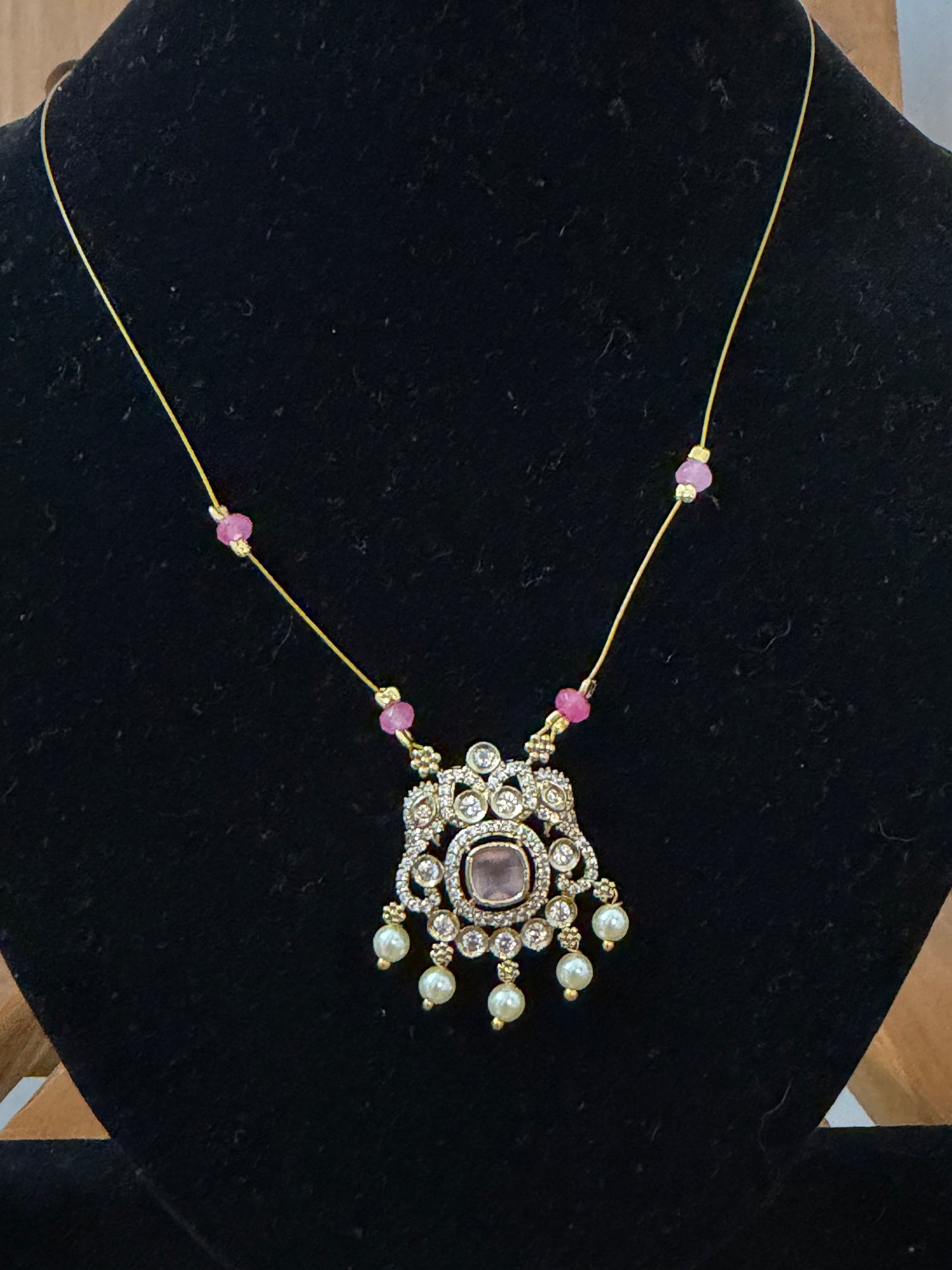 Invisible necklace with pastel soft pink stone