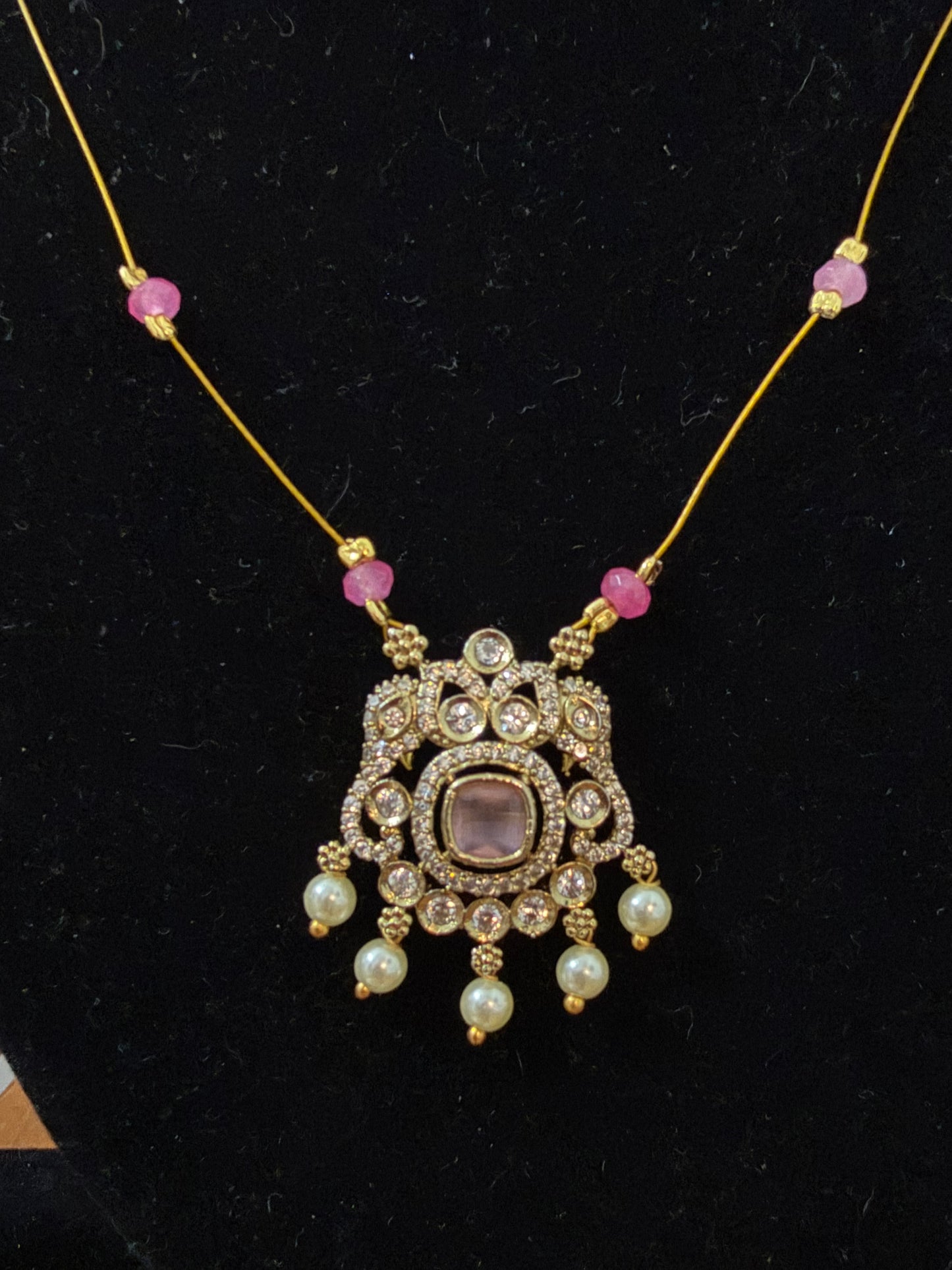 Invisible necklace with pastel soft pink stone