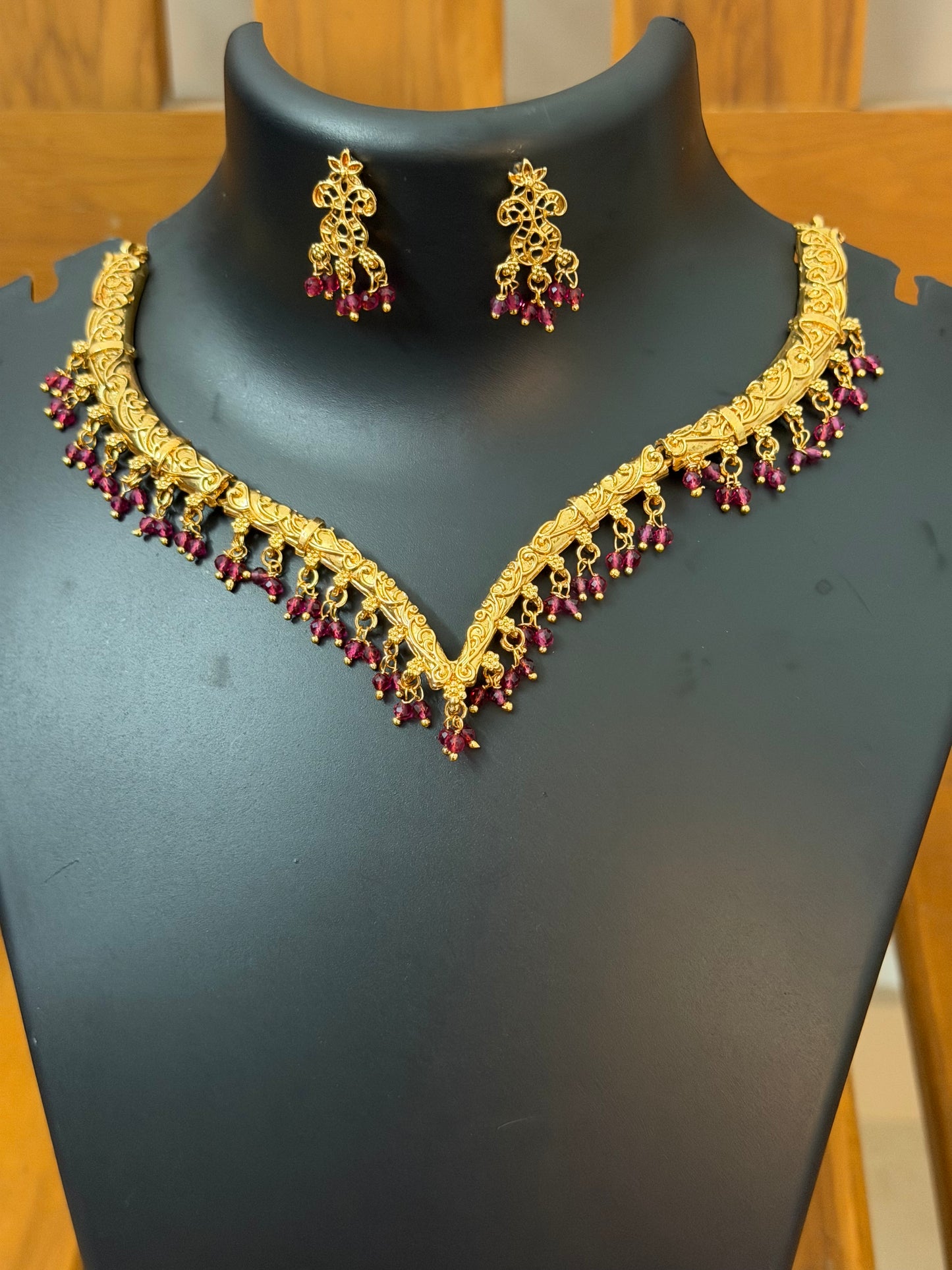 V shaped necklace with ruby color pearl hanging : Code RJ1250