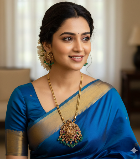 Sublime Antique Gold Lakshmi Pendant Set with Double Chain & Emerald Green Drops