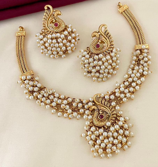 . ✨ Introducing the Peacock Royalty Set—a cascade of stunning clustered beads in your choice of Ruby Red, Lush Emerald, or Classic Pearl. This isn't just a necklace; it's a statement. Limited stock just dropped. Shop the only piece of jewelry that matters