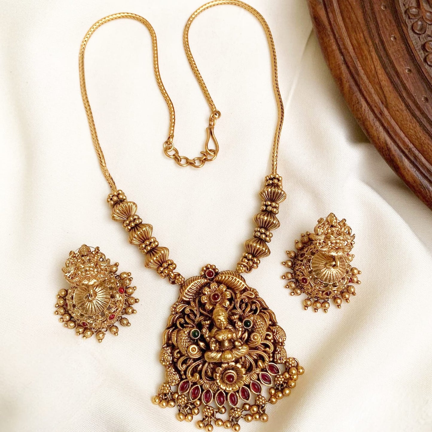 Grand Antique Gold Lakshmi Motif Choker Set with Intricate Details & Ruby Kemp Stones