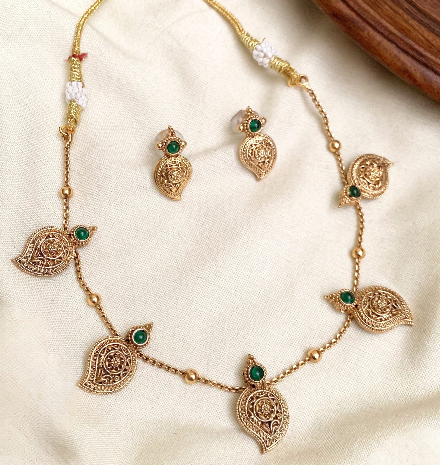 Delicate Antique Gold Mango Necklace Set with Green Stones: The Minimalist Mango: Delicate Antique Gold Chain with Green/Red Stone Motifs