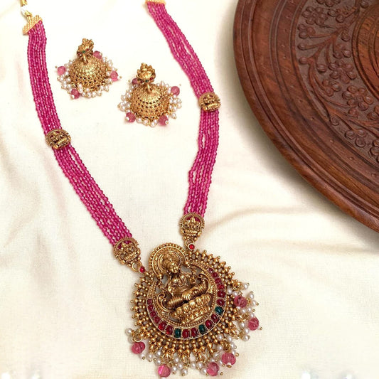 Divine Lakshmi Antique Gold & Ruby Pink Long Necklace Set: Antique Matte Gold Lakshmi Temple Necklace Set with Ruby Pink Beads & Jhumkas