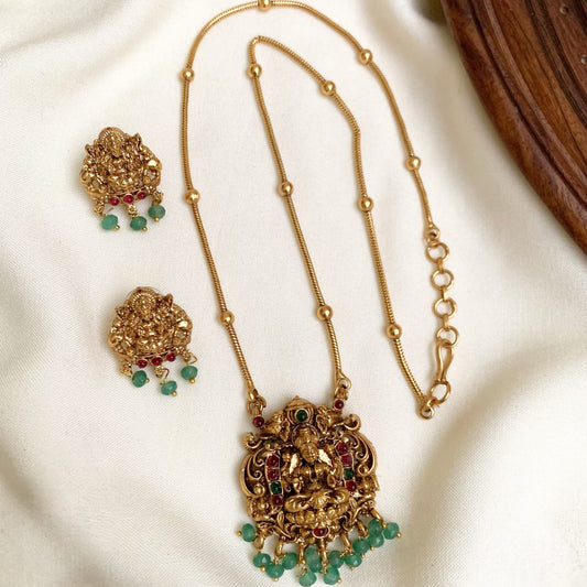 Classic Antique Gold Lakshmi Pendant Necklace Set with Green Bead Accents