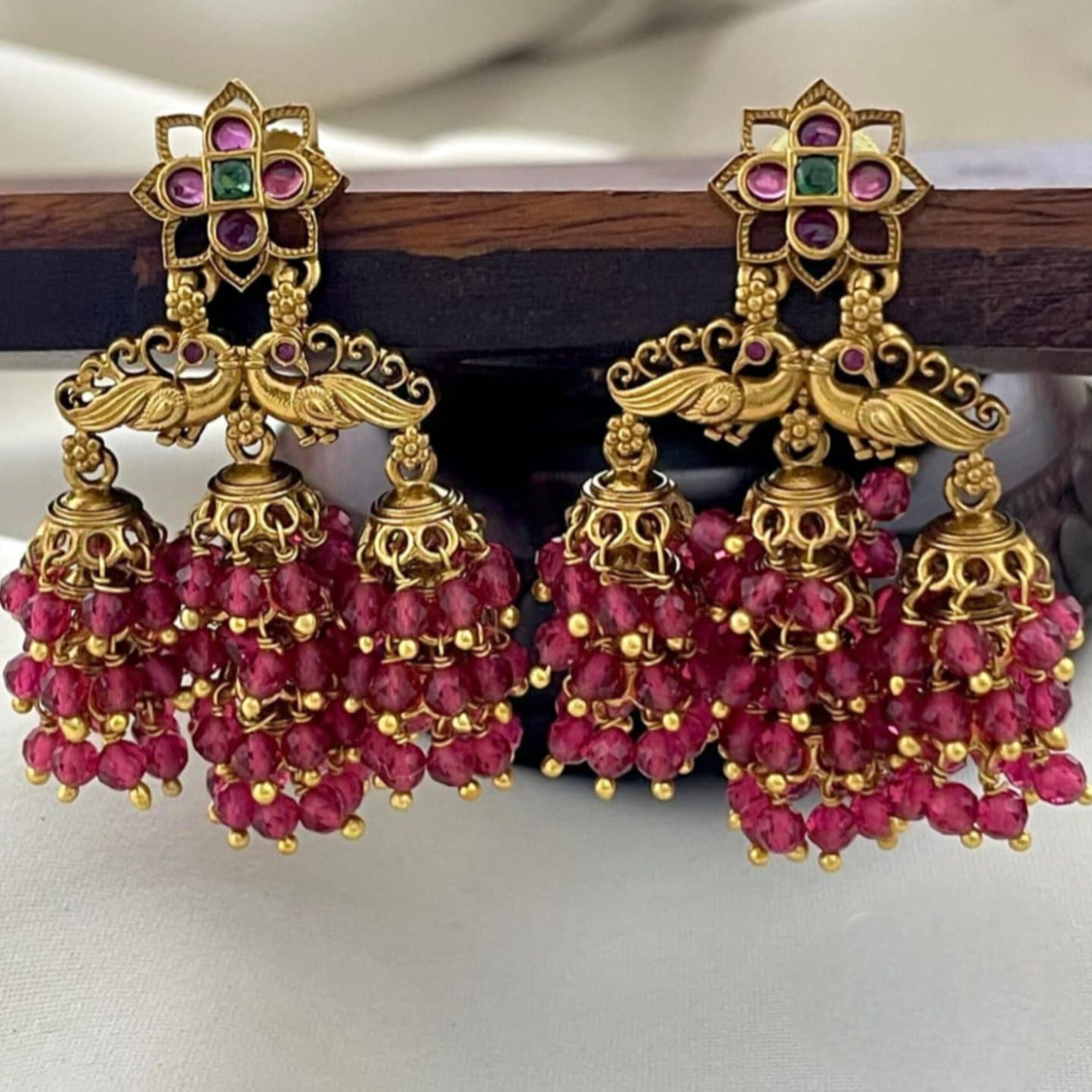 Gold-Finish Ruby Jhumka Earrings | Peacock Design Temple Jewellery for Weddings & Festive Wear EK
