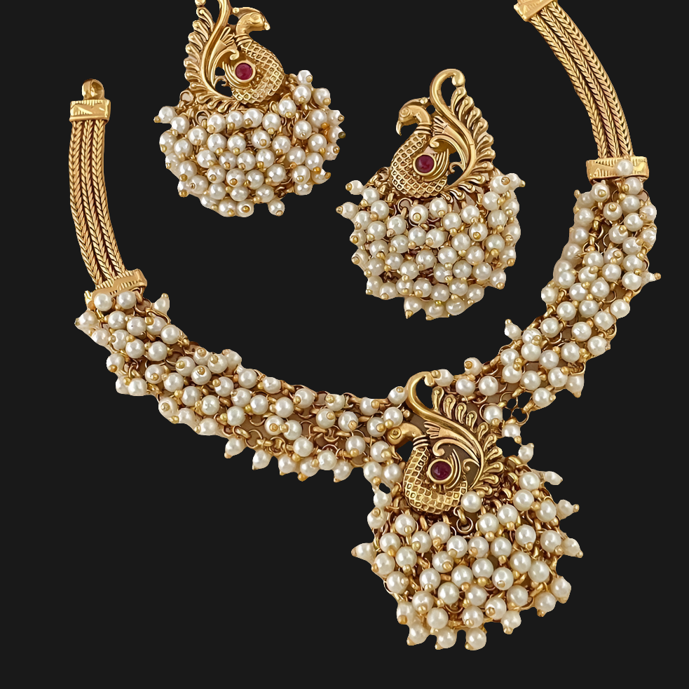 "✨ Behold! Where elegance meets enchantment. ✨ Adorn yourself with this exquisite matte gold and pearl necklace set, featuring a captivating peacock design that whispers tales of timeless grace. Perfect for weddings, festivities