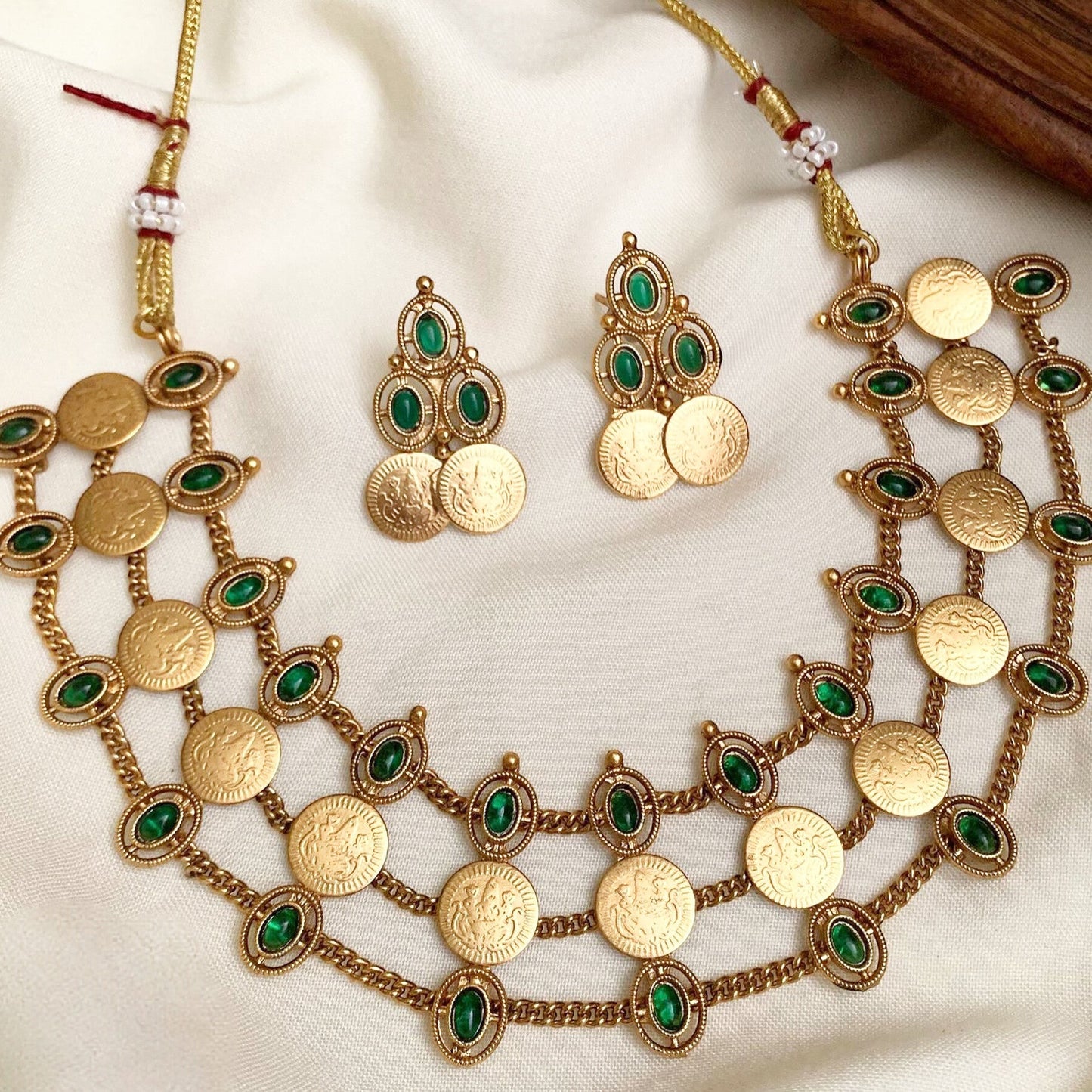 South Indian Temple Jewelry Set | Gold Plated Coin Necklace with Green Kemp Stones: Antique Matte Gold Coin Choker Set with Emerald Green Stones – Double Layer Temple Jewelry